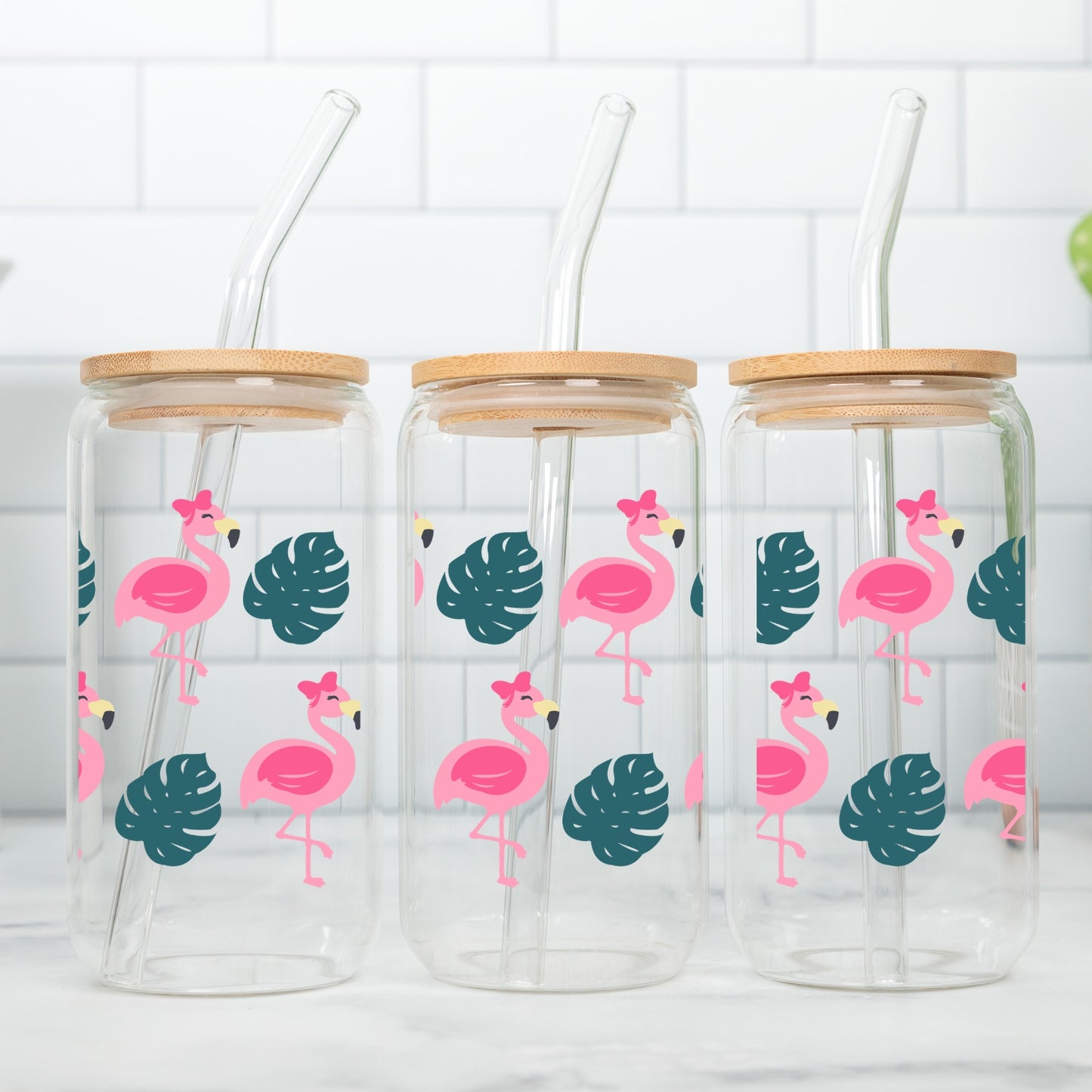 Flamingos With Bows 16 oz Glass Tumbler with bamboo lid and glass straw.