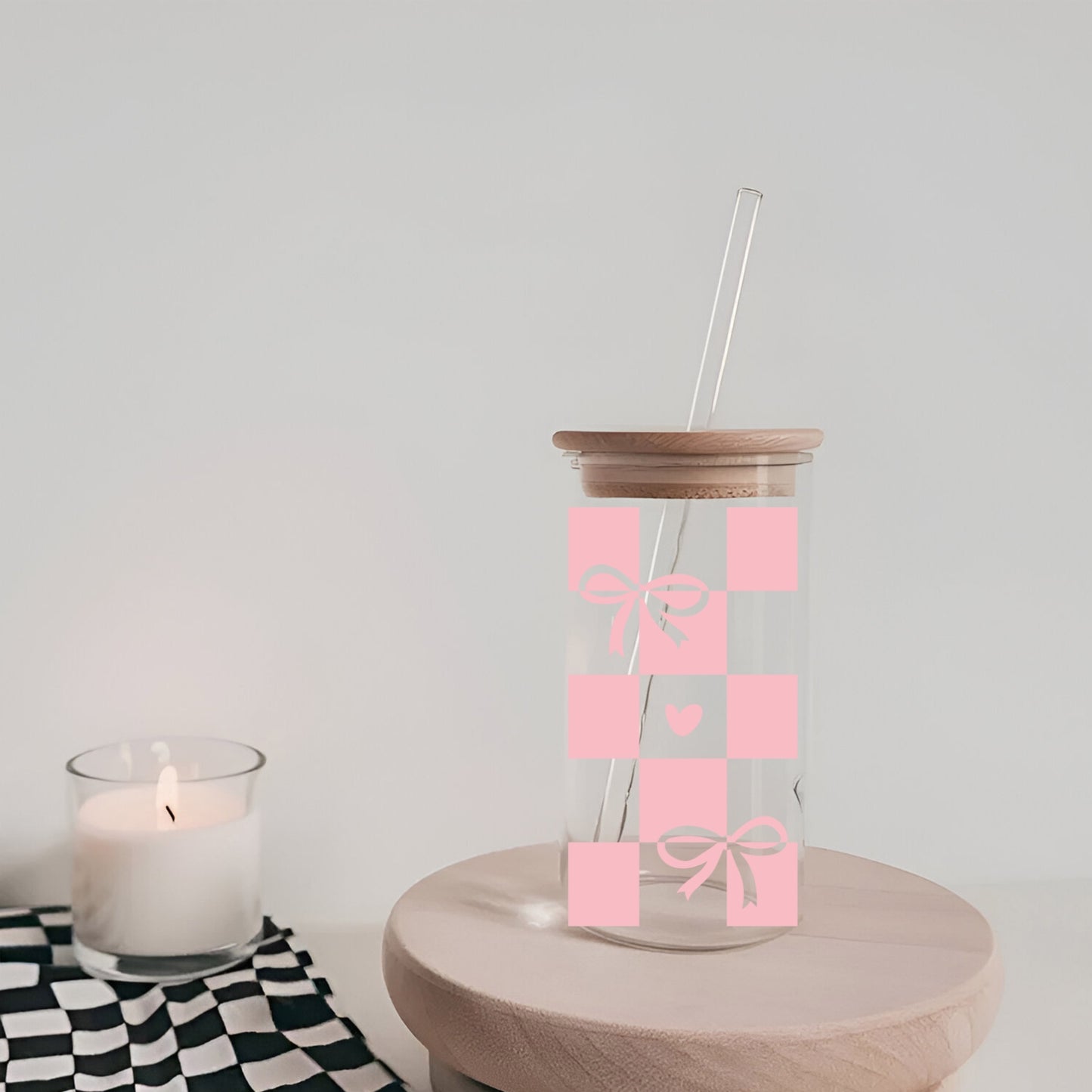 Chequered Coquette Bows And Hearts 16 oz Glass Tumbler with bamboo lid and glass straw.