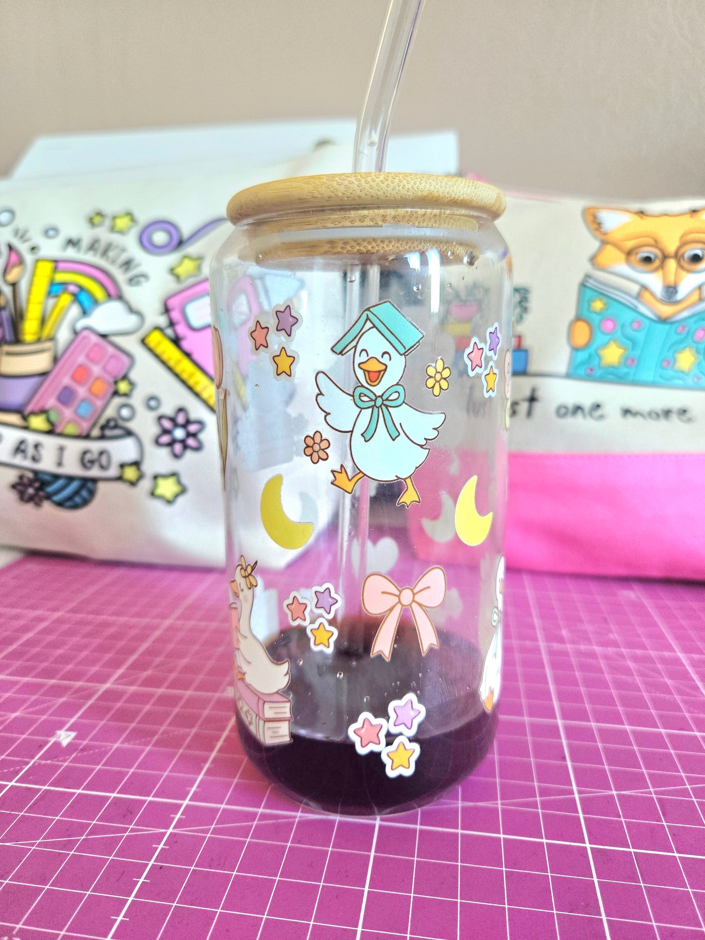 The Cosy Bookish Goose 16 oz Glass Tumbler with bamboo lid and glass straw.