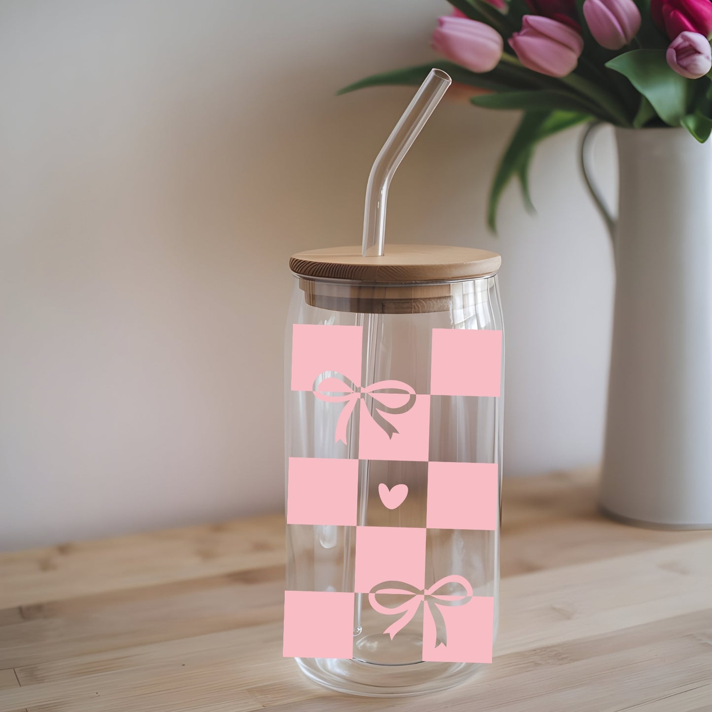 Chequered Coquette Bows And Hearts 16 oz Glass Tumbler with bamboo lid and glass straw.