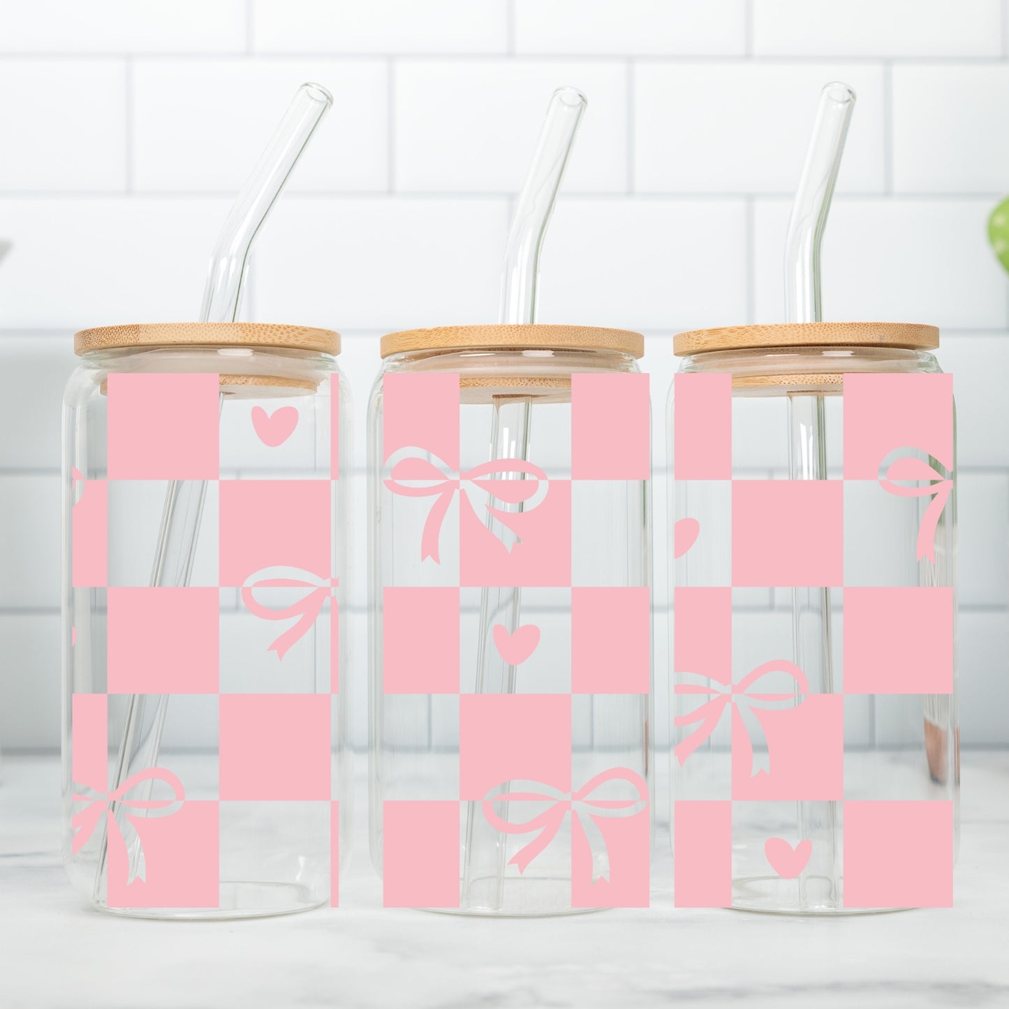 Chequered Coquette Bows And Hearts 16 oz Glass Tumbler with bamboo lid and glass straw.